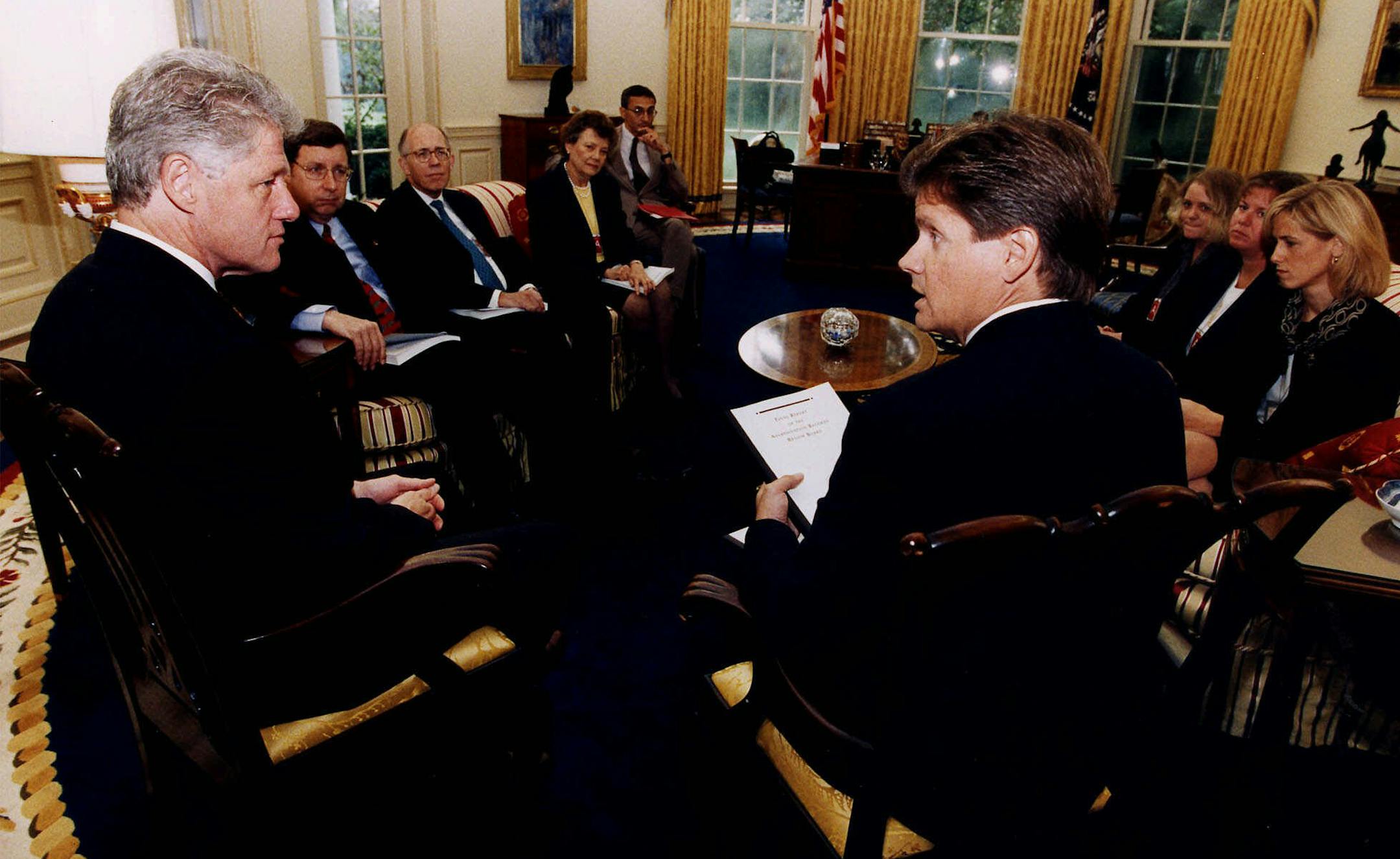 President Clinton meets with members of the Assassination Records Review Board in the Oval Office of the White House Wednesday Sept. 30, 1998. Counterclockwise from the president are chairman John Tunheim, Laura Denk, Tracy Shycoff, Eileen Sullivan, White House Deputy Chief of Staff John Podesta, Anna Kasten Nelson, William Joyce and Kermit Hall. The board investigated the assassination of President Kennedy 1963. (AP Photo/White House) ORG XMIT: WX114