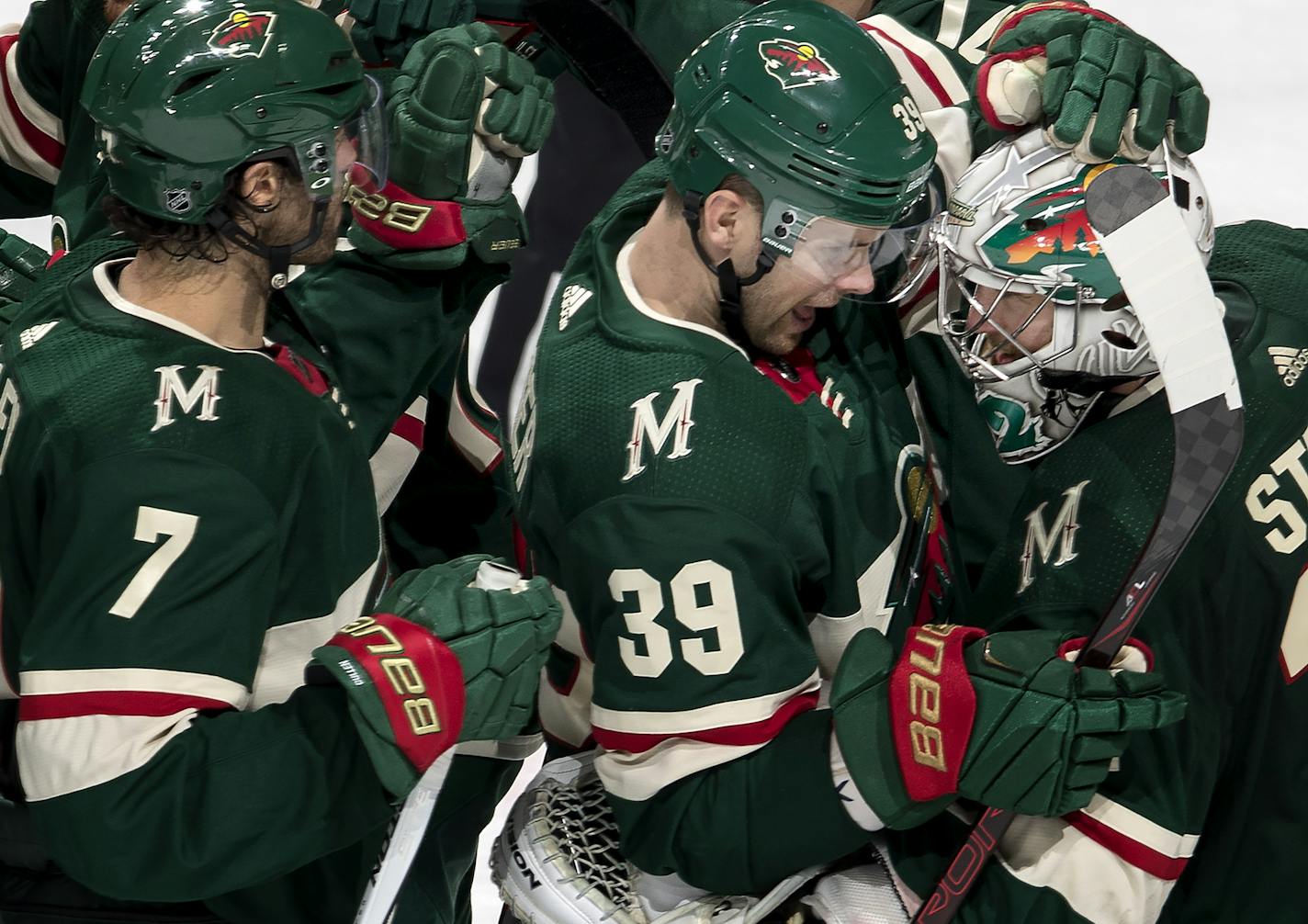 Wild goalie Alex Stalock (32) celebrated with Nate Prosser (39) at the end of the game. ] CARLOS GONZALEZ &#xef; cgonzalez@startribune.com - December 27, 2017, St. Paul, MN, Xcel Energy Center, NHL, Hockey, Minnesota Wild vs. Dallas Stars