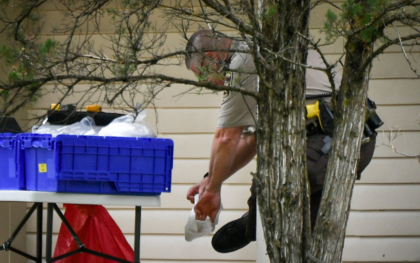 A Hennepin County Sheriff's investigator put on protective footwear before entering the home in which two bodies were found Thursday morning. ] GLEN STUBBE &#x2022; glen.stubbe@startribune.com Thursday May 25, 2017 Eden Prairie Police and Hennepin County Sheriff's office investigated a crime scene in Eden Prairie where two adults were found dead Thursday morning. A person of interest was arrested a few hours later. The address was 6770 Woodhill Trail, Eden Prairie.