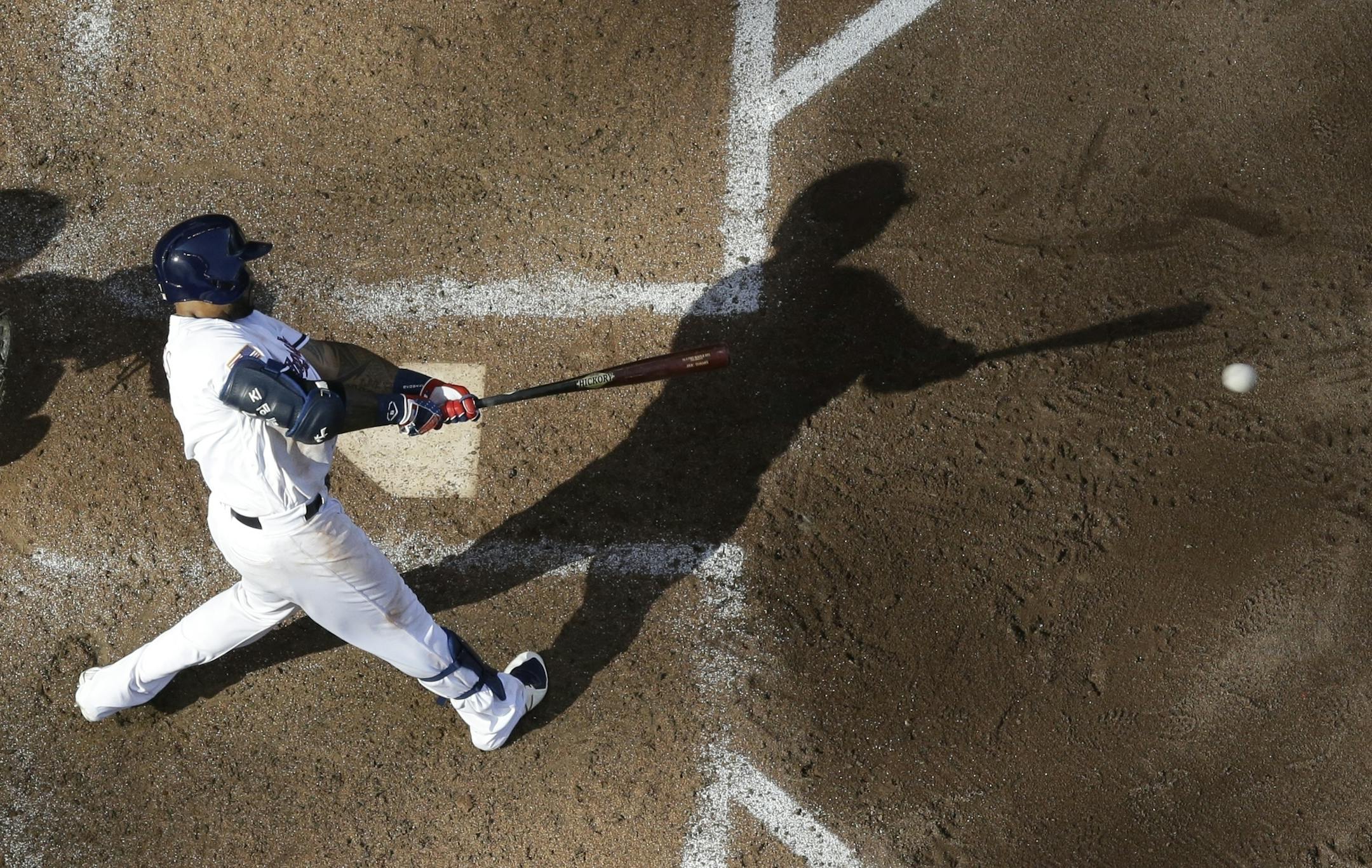 Milwaukee Brewers' Eric Thames hits a two-run home run during the fifth inning of a baseball game against the Minnesota Twins Tuesday, July 3, 2018, in Milwaukee. (AP Photo/Morry Gash)