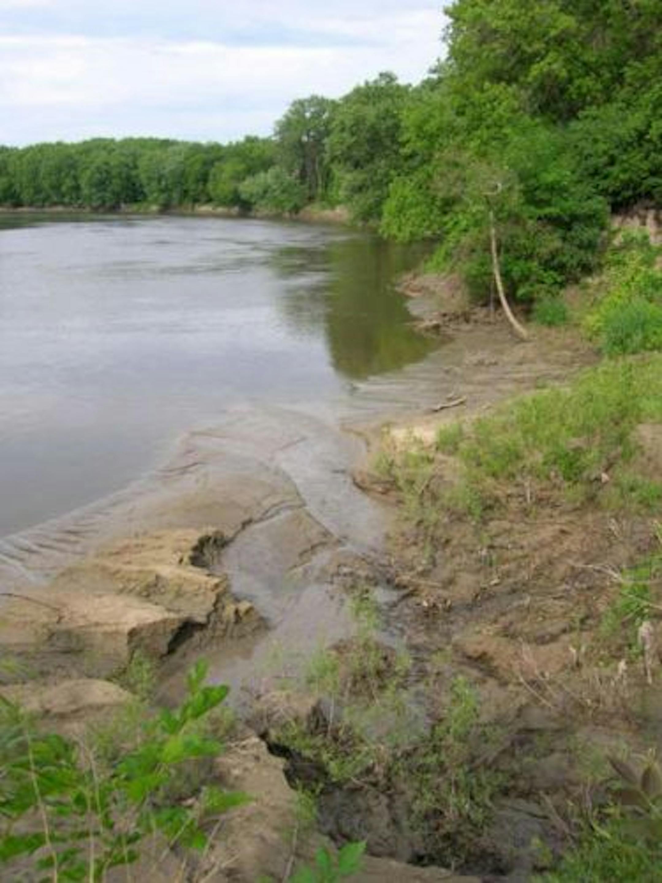 The Minnesota River over about 20 years has cut 115 feet north toward Eden Prairie, undermining the shoreline and causing the river bank to cave in. "We would like to have a permanent correction to this," said Terry Schwalbe, executive director of the watershed district.