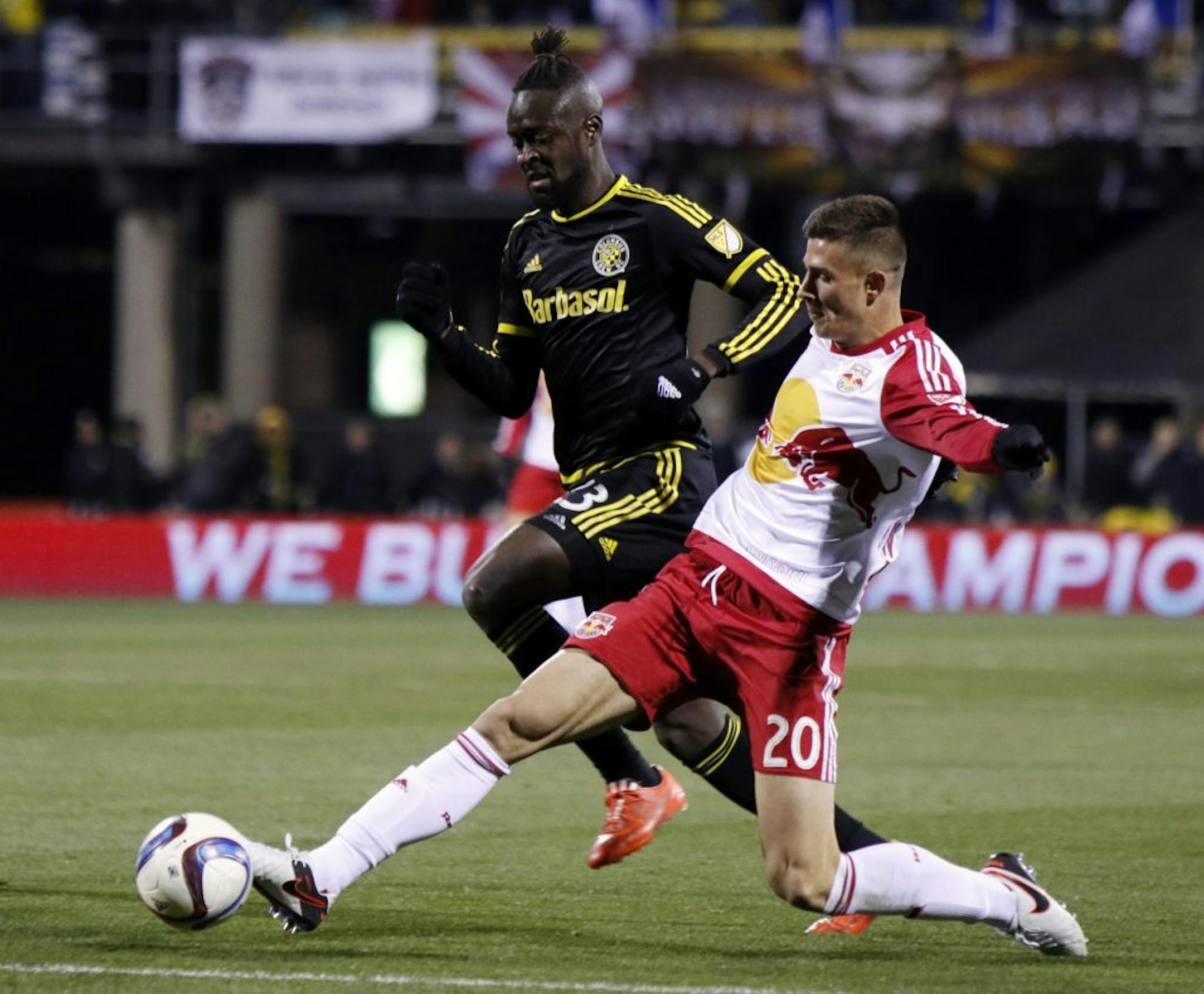 New York Red Bulls defender Matt Miazga, right, works for the ball against Columbus Crew forward Kei Kamara during the first half in the first leg of the MLS soccer Eastern Conference championship in Columbus, Ohio, Sunday, Nov. 22, 2015.
