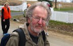 Tom Warth, founder of Books for Africa, was among about 30 walkers on the first leg of a 50-mile journey through Washington County en route to St. Pau