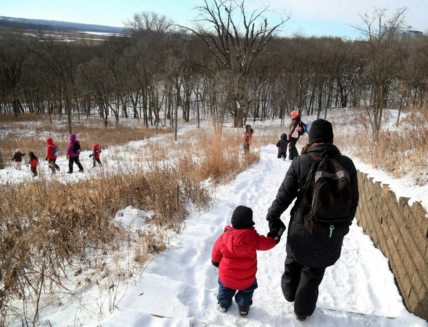 The Minnesota Valley Wildlife Refuge is one of the sites affected by the federal shutdown. Its trails are still open, but the visitor center is closed. Above, children with the Free Forest School and their parents headed into the woods to play in January.