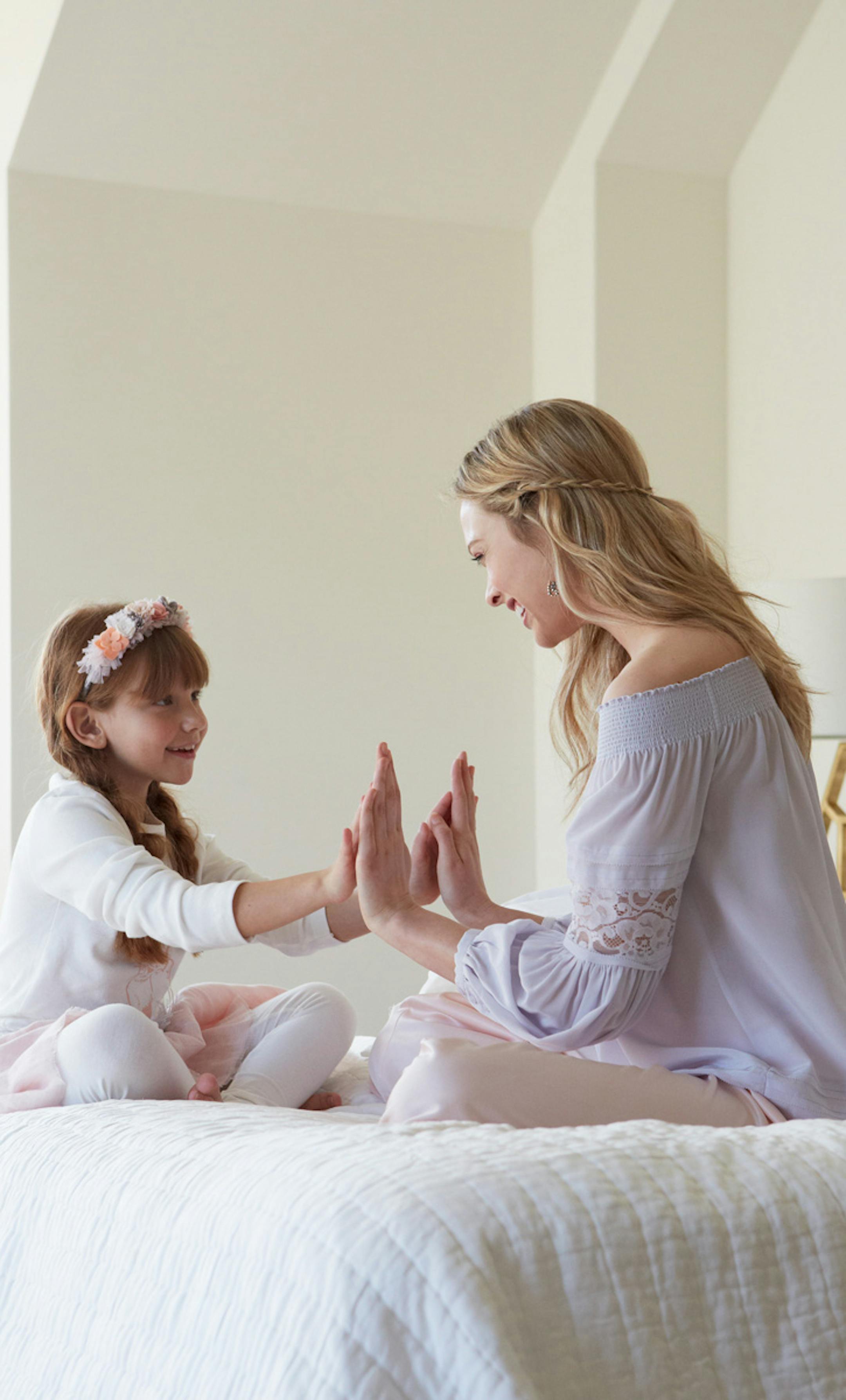 Amaya left: Floral headband $95, white t-shirt with hand-screened bunny $45, feather Tutu Topper, $40, Glinda Fairy skirt $100, cotton legging $36 all from ohbabystyle.com. Meridith right: Olivia Palermo purple puff blouse $128, nordstrom.com; Pink satin pant $28, luluvintage.com. Easter dress shoot. Photographer Lauren Krysti, laurenkrysti.com Art Director and Stylist Barbara Schmidt, studiobstyle.com Hair and Make-up Artist Fatima Olive, wehmann.com Models: Meridith Gould, moorecreativetalent.