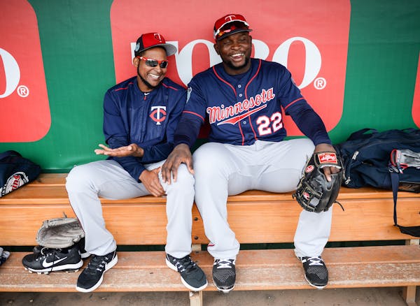 Minnesota Twins starting pitcher Ervin Santana (54) and third baseman Miguel Sano (22) joked around in the dugout as they watched live batting practic