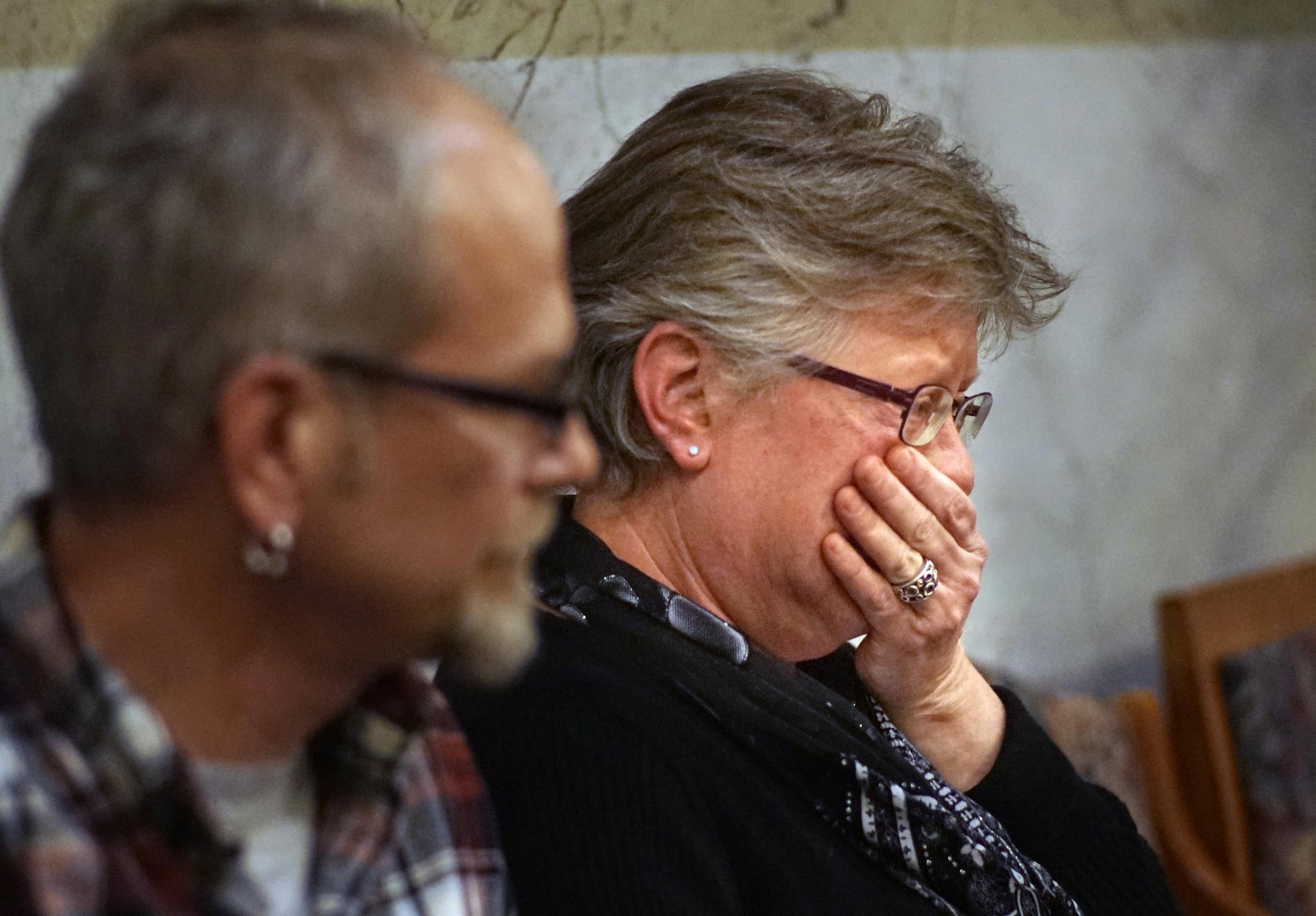 During a Heritage Preservation Commission meeting, Kari Christianson became emotional after speaking in opposition to historic designation for Homewood. She and her husband Dave(left) have made many renovations to their home over the years. She is not sure they can afford to maintain it to historic home designation code.] North Minneapolis' Homewood neighborhood, a close-knit community with a long history of diversity, is up for historic designation status. The trouble is, many of the people liv