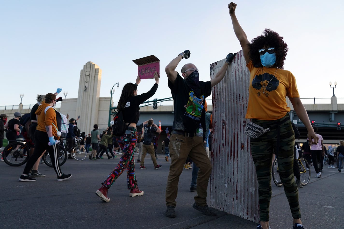 Protesters marched on East Lake Street after beating back a team of state troopers firing tear gas at them during another night of demonstrations over the death of George Floyd. ] ANTHONY SOUFFLE • anthony.souffle@startribune.com Police and community members braced for more demonstrations over the death of George Floyd in police custody as both Minneapolis and St. Paul, as well as Gov. Walz, issued curfews to try and curtail the looting and riots that have gone on all week Friday, May 29, 2020 i