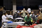 People take shelter as Hurricane Maria approached at the Roberto Clemente Coliseum in San Juan, Puerto Rico, Sept. 19, 2017. Almost two weeks after be