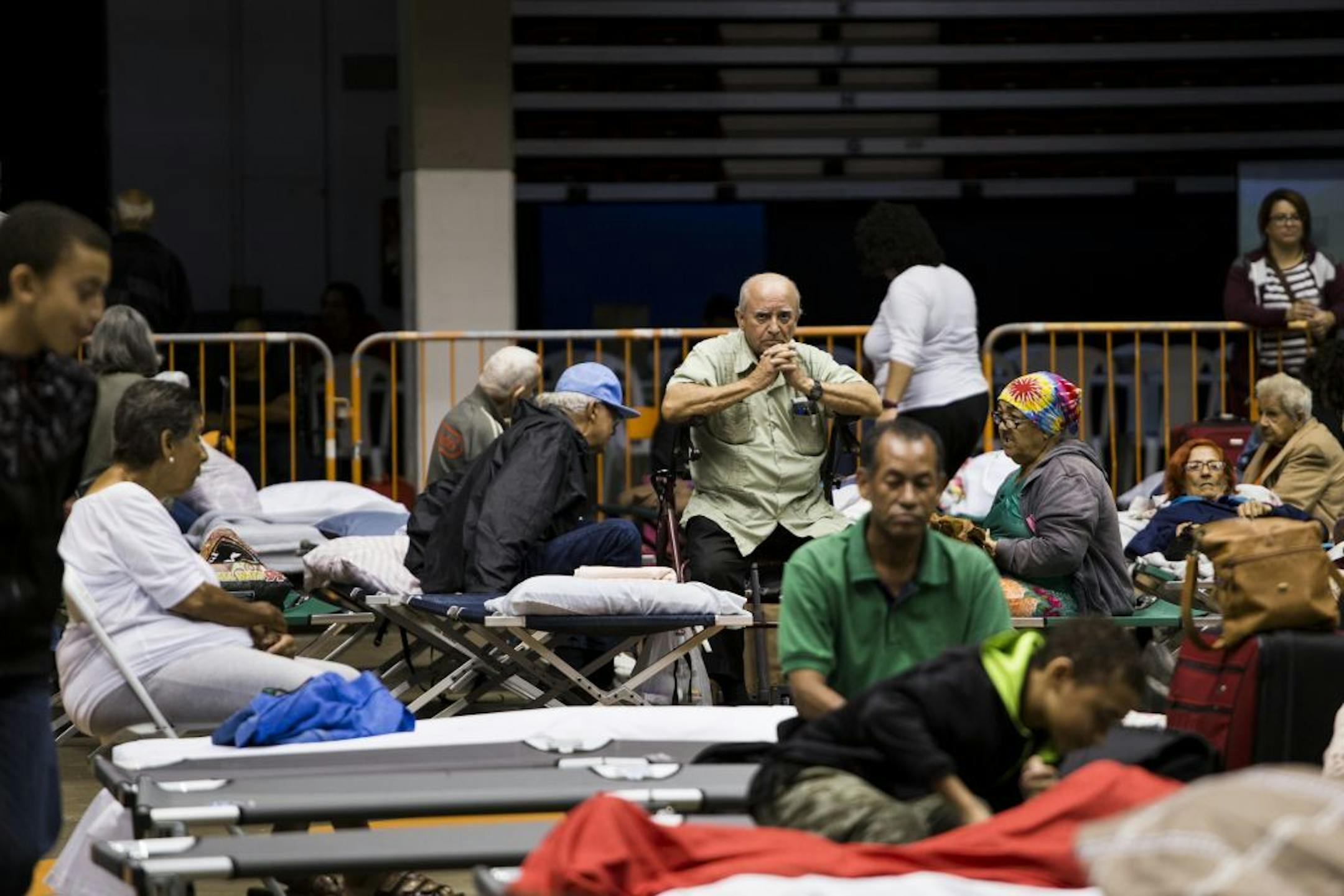 People take shelter as Hurricane Maria approached at the Roberto Clemente Coliseum in San Juan, Puerto Rico, Sept. 19, 2017. Almost two weeks after being grazed by Hurricane Irma, Puerto Rico was bracing for a potentially devastating sequel: a direct hit from what could be the first Category 5 hurricane to strike here in close to a century.