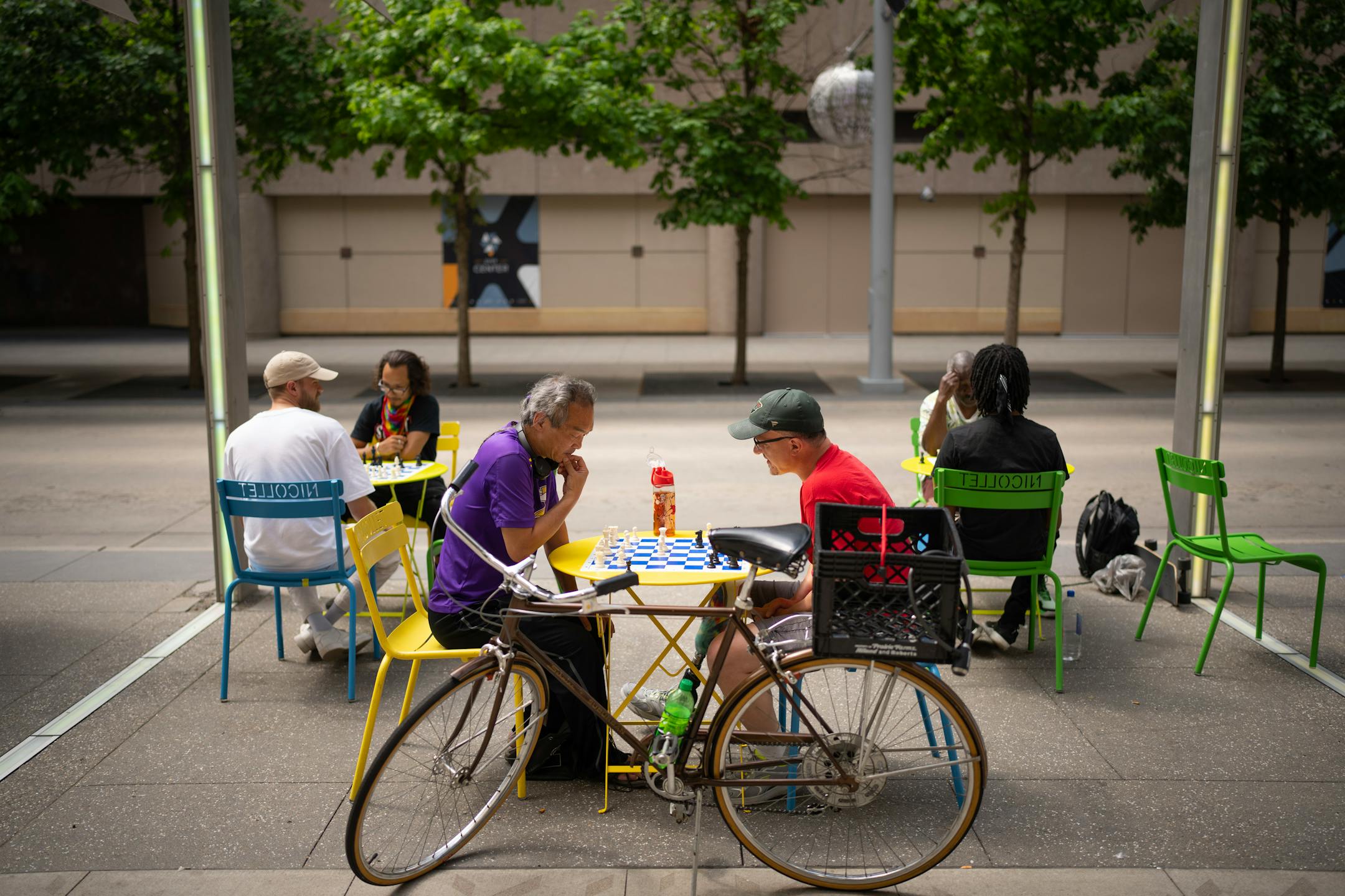 Duc Nguyen, left, and Robert Watson were among several people playing chess on outdoor boards along the Nicollet Mall Tuesday afternoon. Minneapolis Mayor Jacob Frey was joined at a news conference Tuesday, June 6, 2023 at Dayton's by members of his newly formed "Vibrant Downtown Storefronts Workgroup" to announce recommendations the group submitted to him.