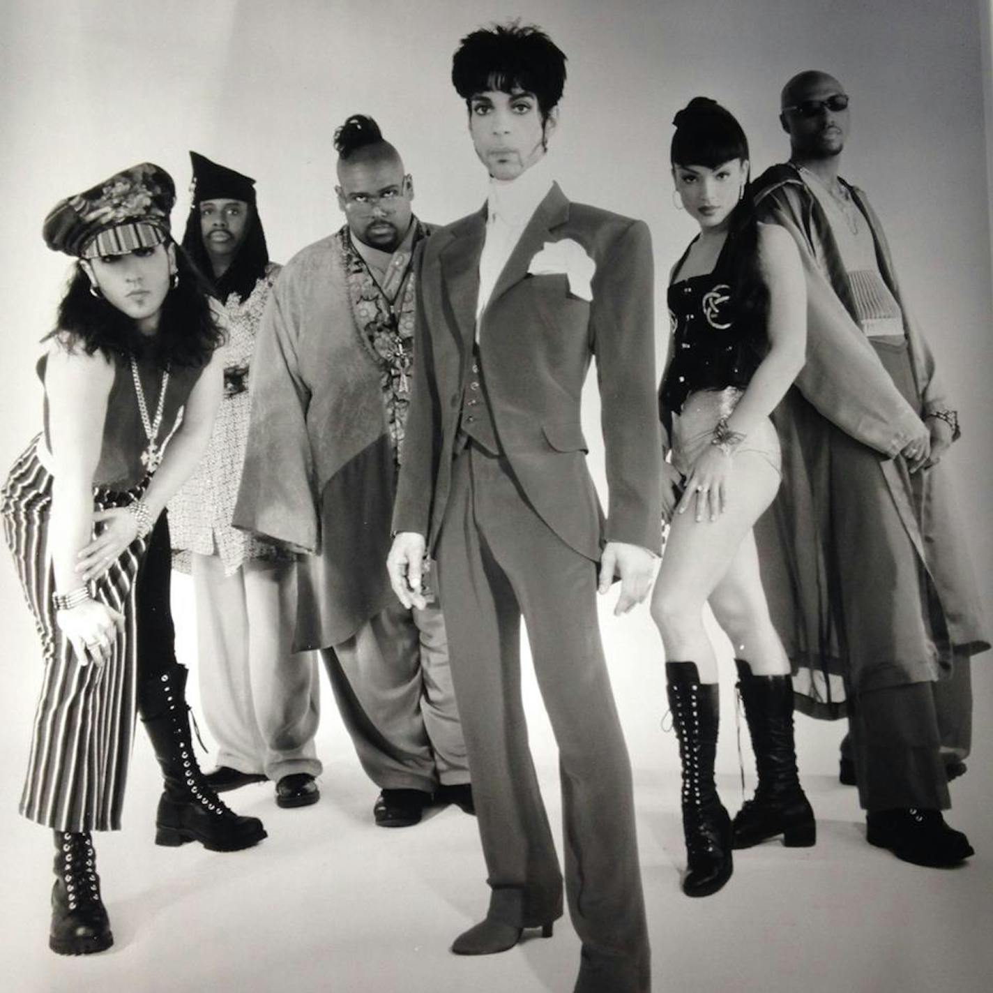 The three members to the left of Prince in this early-&#xed;90s New Power Generation publicity photo are paying tribute to him this weekend, from left: Tommy Barbarella, Sonny Thompson and Michael Bland. ORG XMIT: WDrzS8R7PYnxeHGbN1Y9