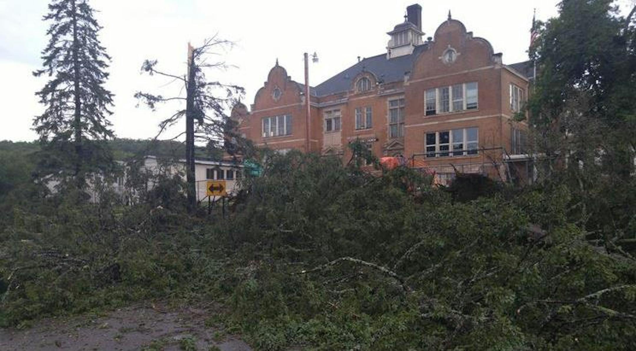 Trees knocked down by a storm blocked a road in front of the Duluth Bible Church.