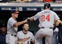 Twins manager Paul Molitor, left, congratulated Trevor Plouffe after Plouffe hit a two-run home run in the first inning of a game against the Indians 