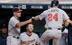 Twins manager Paul Molitor, left, congratulated Trevor Plouffe after Plouffe hit a two-run home run in the first inning of a game against the Indians 