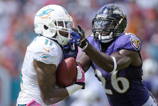 Mike Wallace of the Miami Dolphins (left)