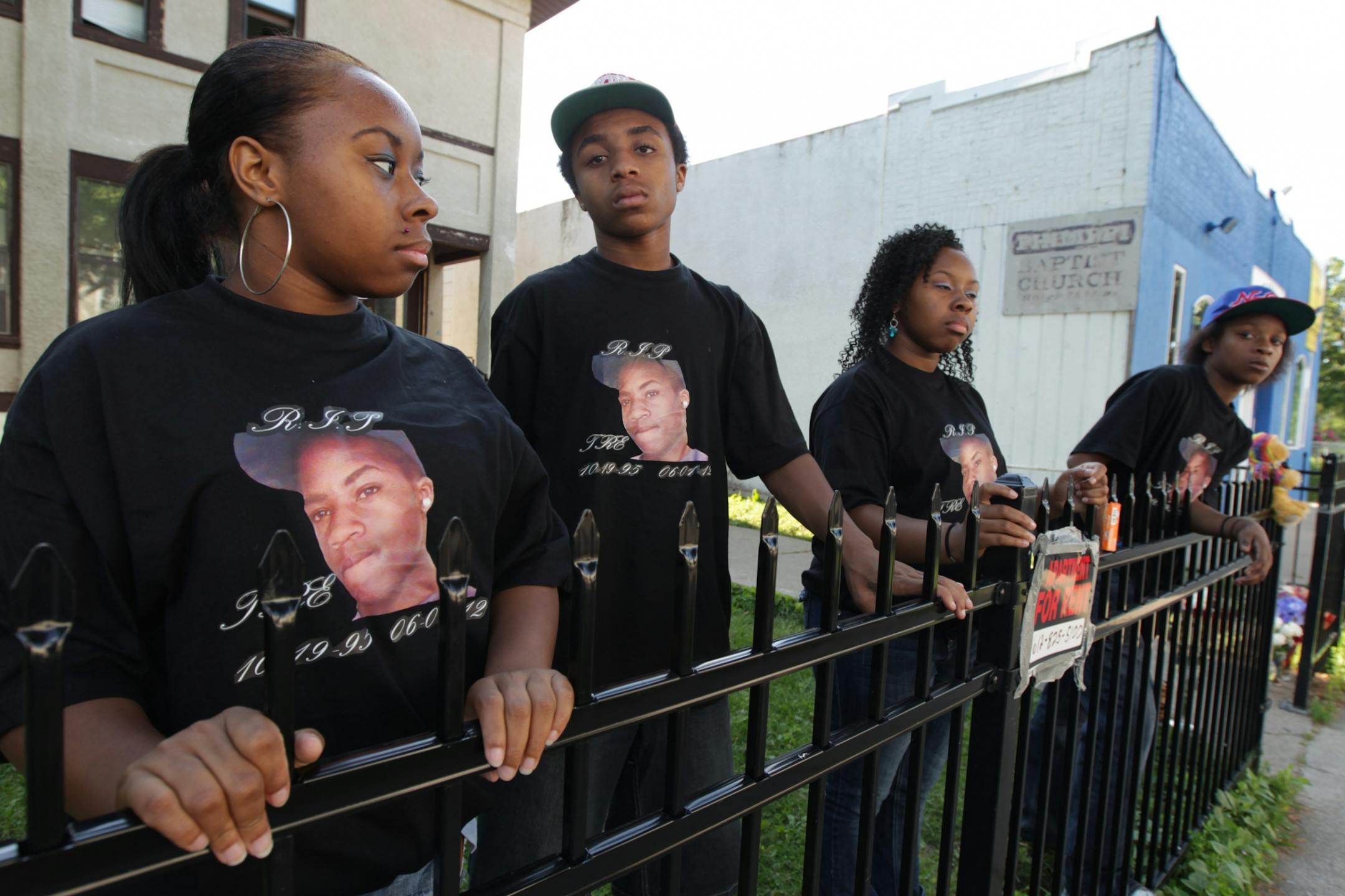 Siblings, from left, Faith Nelson, Perry Singleton, Hope Nelson and Shadana Sykes wore a tee shirt with a photograph of their brother Trequan Sykes, 16, who was fatally shot on June 1 in South Minneapolis.
