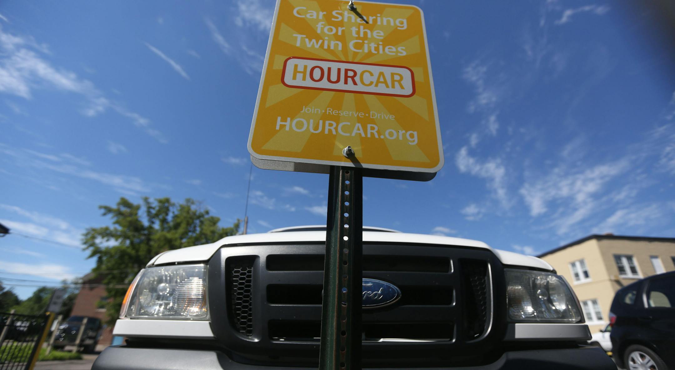 Hourcars parked near Macalester College. ] (KYNDELL HARKNESS/STAR TRIBUNE) kyndell.harkness@startribune.com Car2Go begins service in St. Paul starting July 19, it was announced Wednesday. Looking to catch folks using HourCars, another car sharing service Shot in St. Paul Min. Wednesday, July 2, 2014.