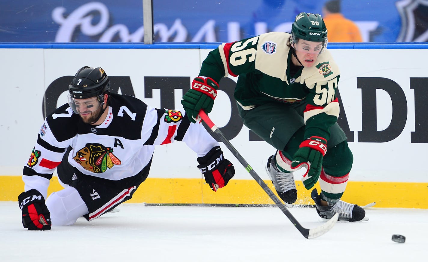 Chicago Blackhawks defenseman Brent Seabrook (7) was called for a tripping call on Minnesota Wild left wing Erik Haula (56) late in the first period for a Wild power play. ] (AARON LAVINSKY/STAR TRIBUNE) aaron.lavinsky@startribune.com The 2016 Coors Light NHL Stadium Series game between the Minnesota Wild and the Chicago Blackhawks was held Sunday, Feb. 21, 2016 at TCF Bank Stadium in Minneapolis, Minn.