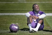 Former Florida State running back Dalvin Cook took in the sun as he waited for a press conference during the first day of Vikings rookie minicamp at W