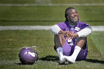 Former Florida State running back Dalvin Cook took in the sun as he waited for a press conference during the first day of Vikings rookie minicamp at W