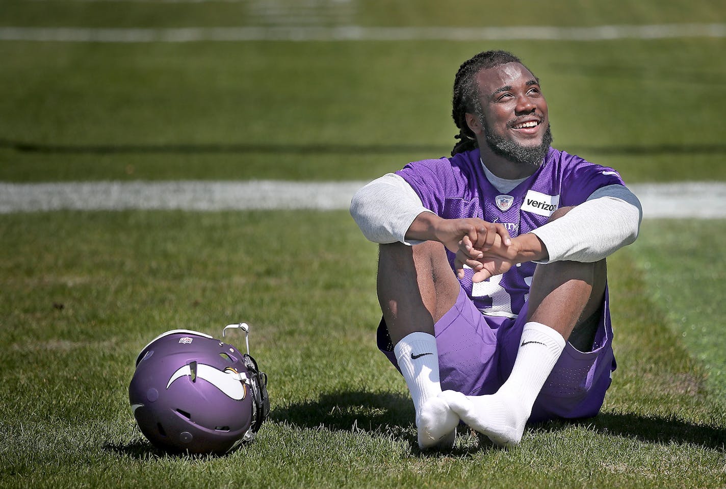 Former Florida State running back Dalvin Cook took in the sun as he waited for a press conference during the first day of Vikings rookie minicamp at Winter Park, Friday, May 5, 2017 in Eden Prairie, MN.