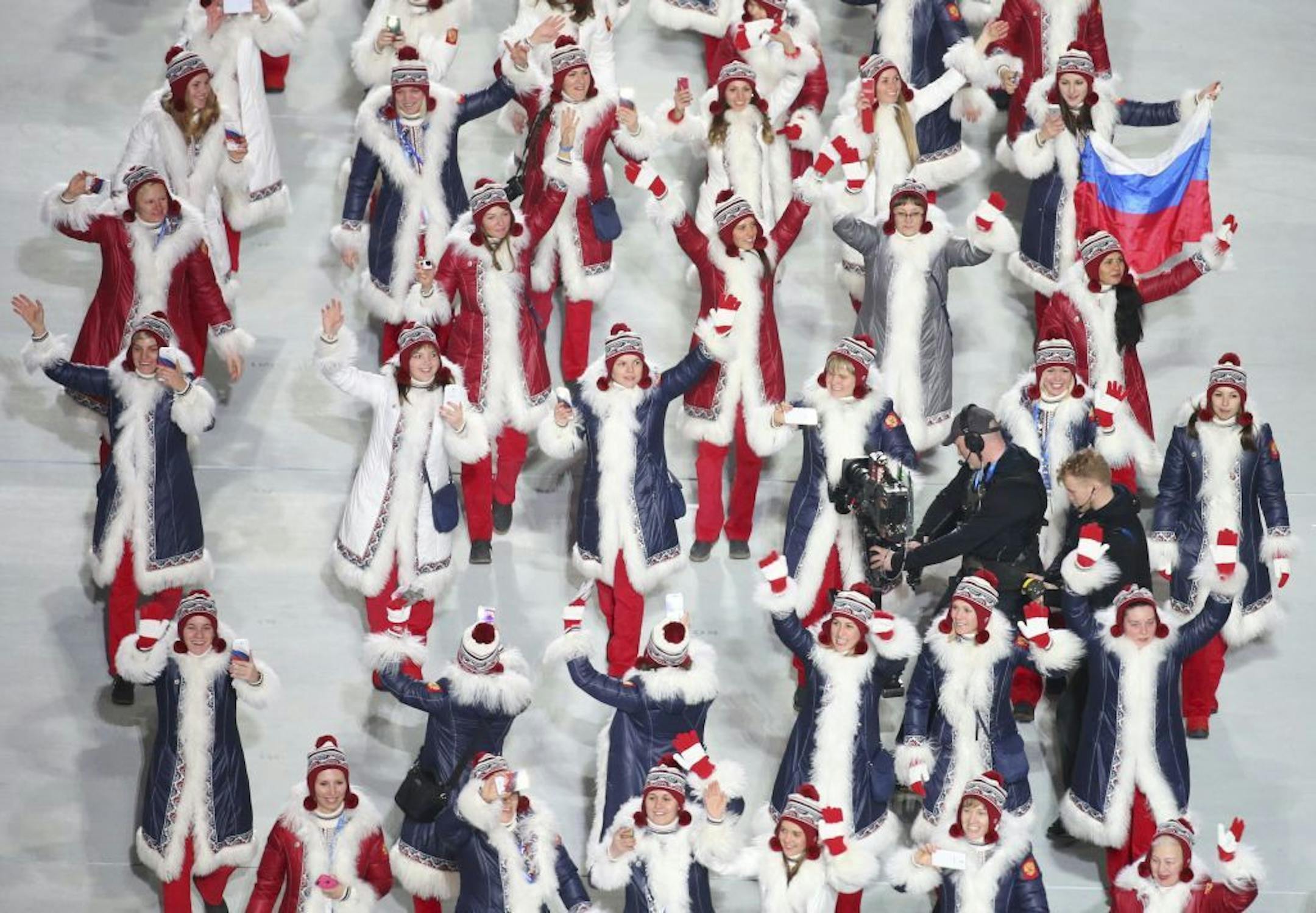 FILE -- Russian athletes at the opening ceremony of the 2014 Sochi Olympic Games, Feb. 7, 2014. Russia's Olympic team has been barred from the 2018 Winter Games in South Korea, an unprecedented punishment for systematic doping handed down by the International Olympic Committee on Dec. 5, 2017.
