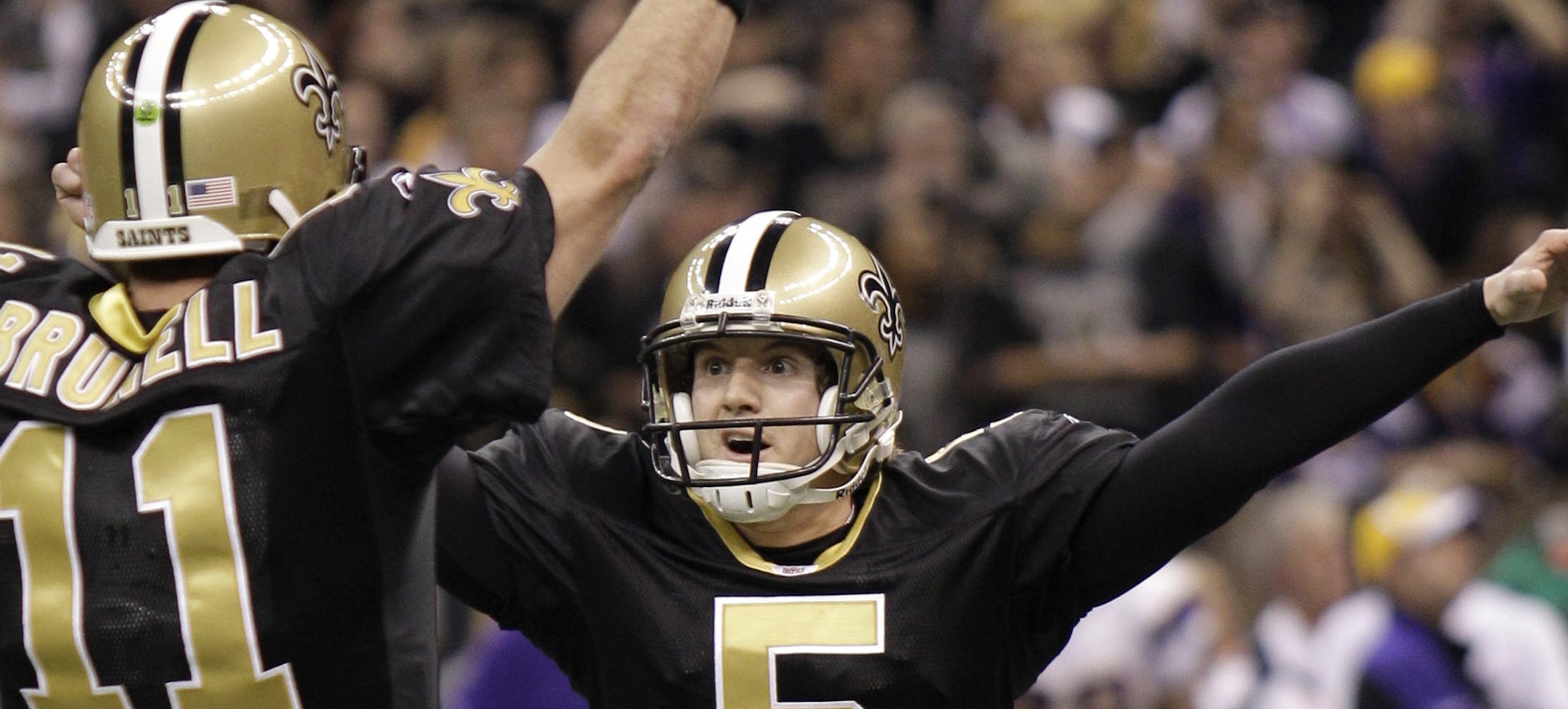 FILE - In this Jan. 24,2 010, file photo, New Orleans Saints kicker Garrett Hartley (5) celebrates with Mark Brunell after kicking the game- winning field goal in overtime in the NFC Championship NFL football gam against the Minnesota Vikings in New Orleans. NFL owners will vote next week whether to allow each team a possession in overtime in the playoffs if the team winning the OT coin toss kicks a field goal on the first series. Previously, the game would end whenever either side scores, as ha