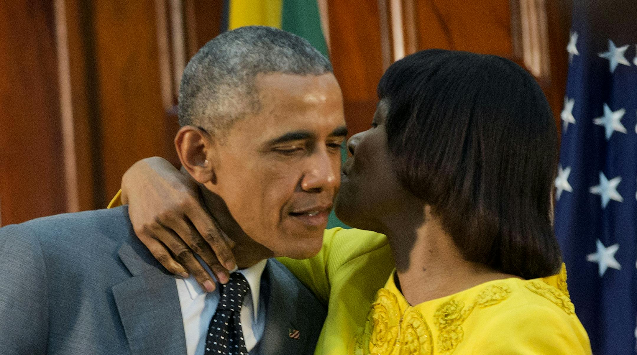 Jamaican Prime Minister Portia Simpson-Miller hugs President Barack Obama following the conclusion of their bilateral meeting at the Jamaica House, Thursday, April 9, 2015, in Kingston, Jamaica. (AP Photo/Pablo Martinez Monsivais)