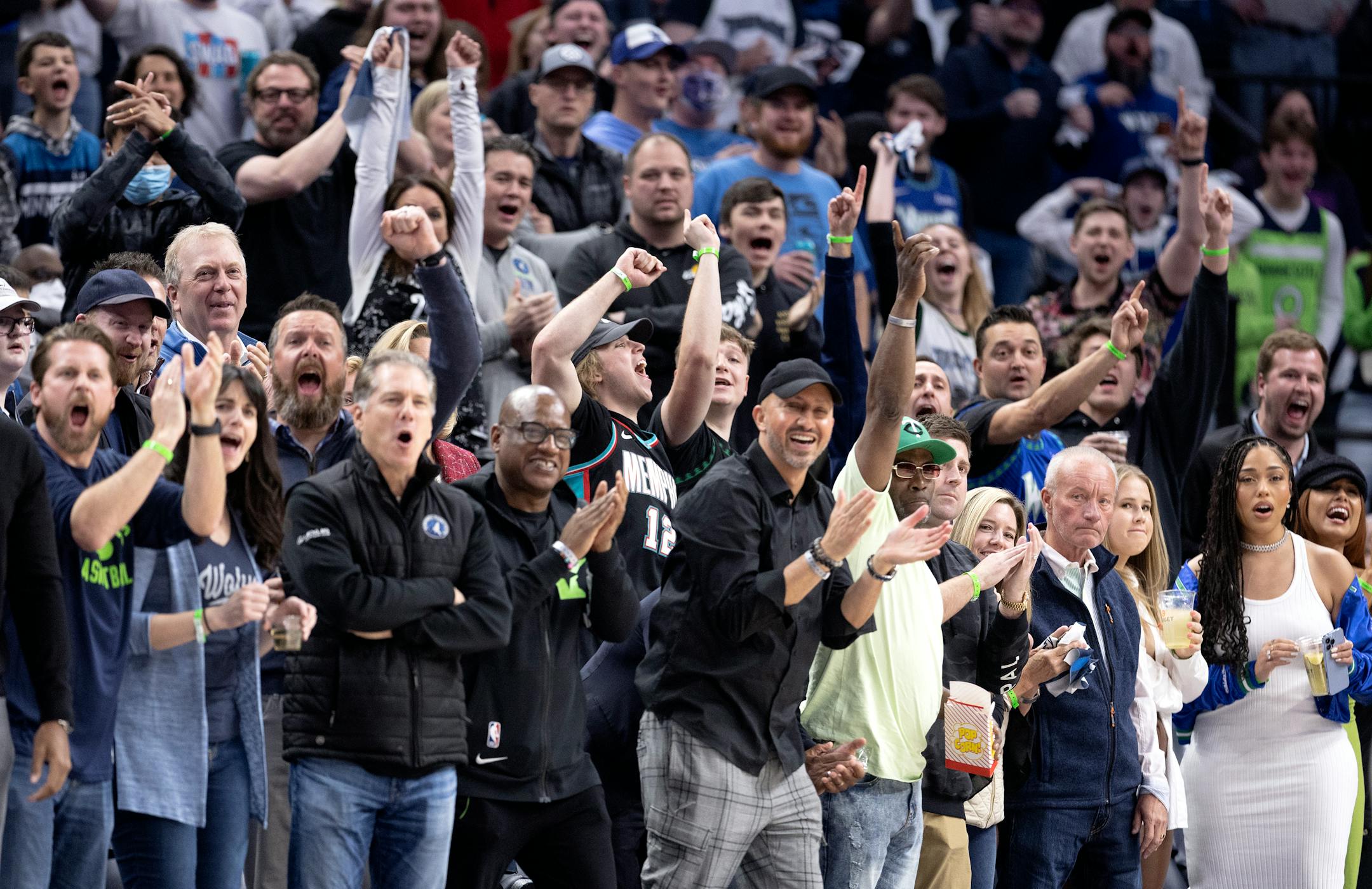 Fans cheer after a Timberwolves basket in the first quarter of game 3 playoffs round one Thursday, April 21, at Target Center in Minneapolis, Minn. ] CARLOS GONZALEZ • carlos.gonzalez@startribune.com