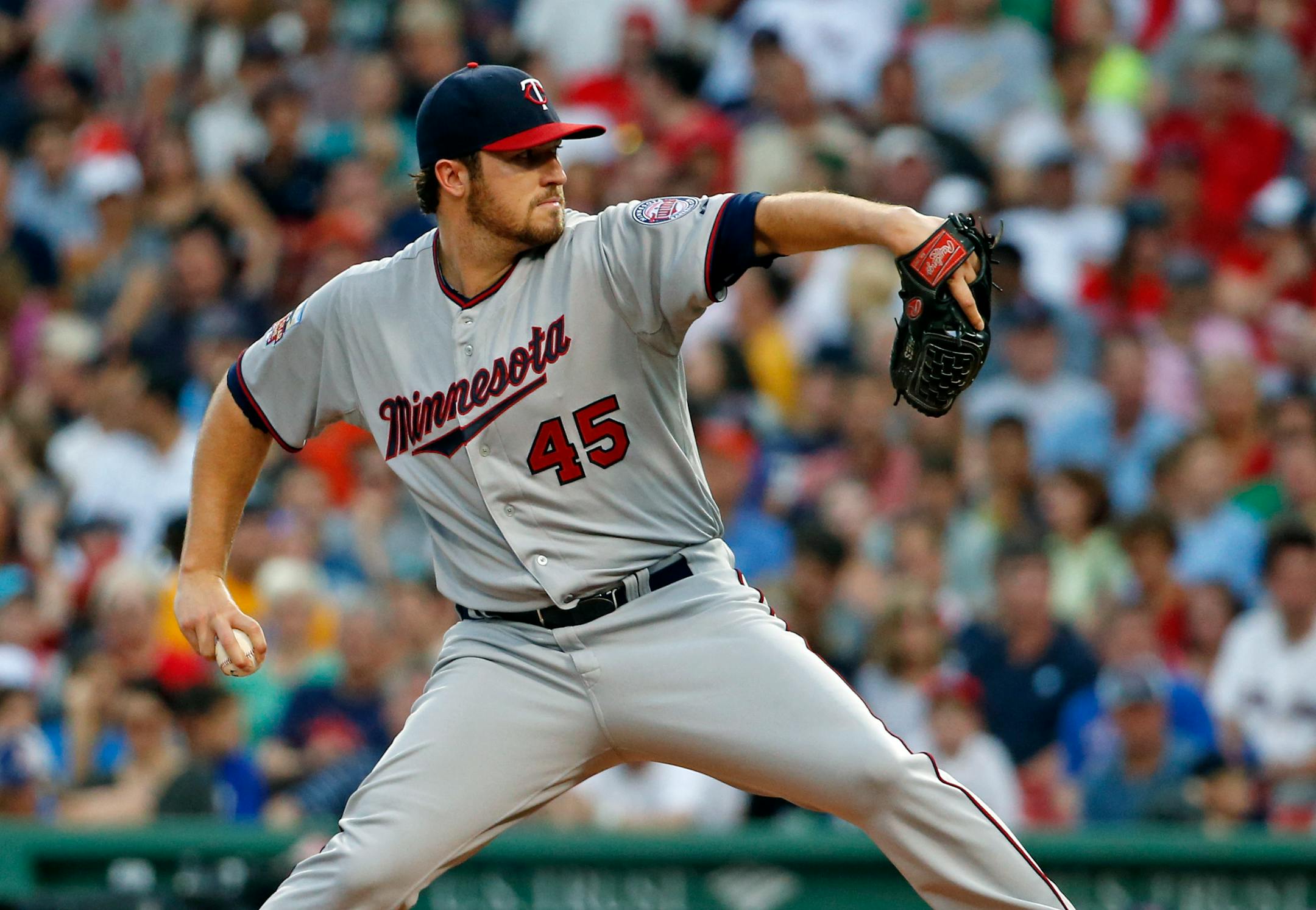 Minnesota Twins starting pitcher Phil Hughes fires one in against the Boston Red Sox in the third inning of a baseball game at Fenway Park in Boston, Tuesday, June 17, 2014. (AP Photo/Elise Amendola)
