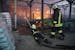 Firefighters put out a fire after two guided bombs hit a large construction supplies store in Kharkiv, Ukraine, Saturday, May 25, 2024.