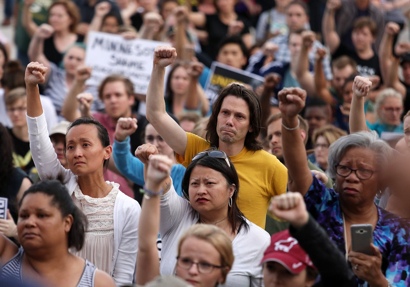 Supporters of Philandro Castile held their fists up in solidarity during the vigil. ] ANTHONY SOUFFLE &#xef; anthony.souffle@startribune.com Supporters of Philando Castile held a vigil after St. Anthony police officer Jeronimo Yanez was found not guilty of all counts in the fatal shooting Friday, June 16, 2017 at the State Capitol Building in St. Paul, Minn.