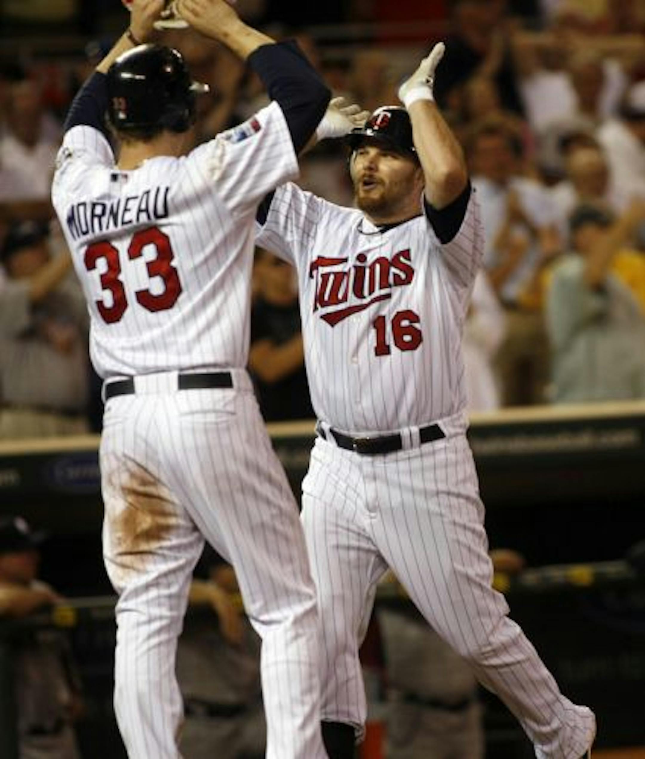 The Twins' Jason Kubel celebrated his three-run home run with Justin Morneau in the seventh inning Thursday night at Target Field.
