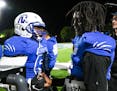 Minneapolis North quarterback Deshaun Hill, right, shook a teammate’s hand after winning a game against SMB Wolfpack in September 2021.