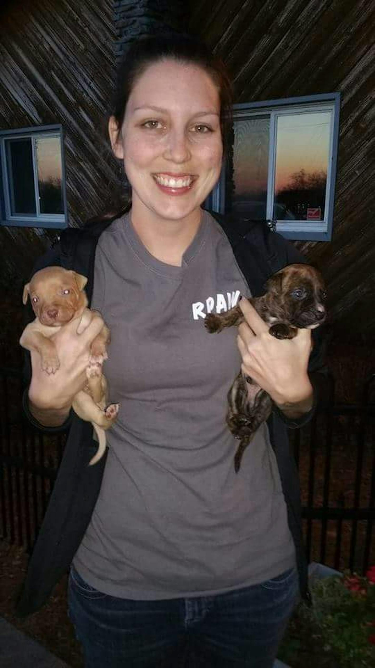 Liz Gigler, with two of the puppies that were taken in a van theft and later returned.