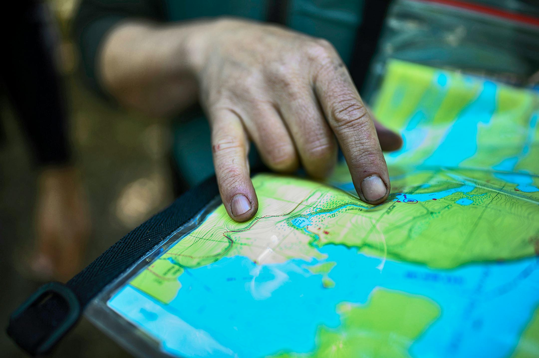 A key part of trip planning for the Boundary Waters Canoe Area Wilderness involves good maps, such as this Fisher Map used by Brad Shannon and Tony Jones.