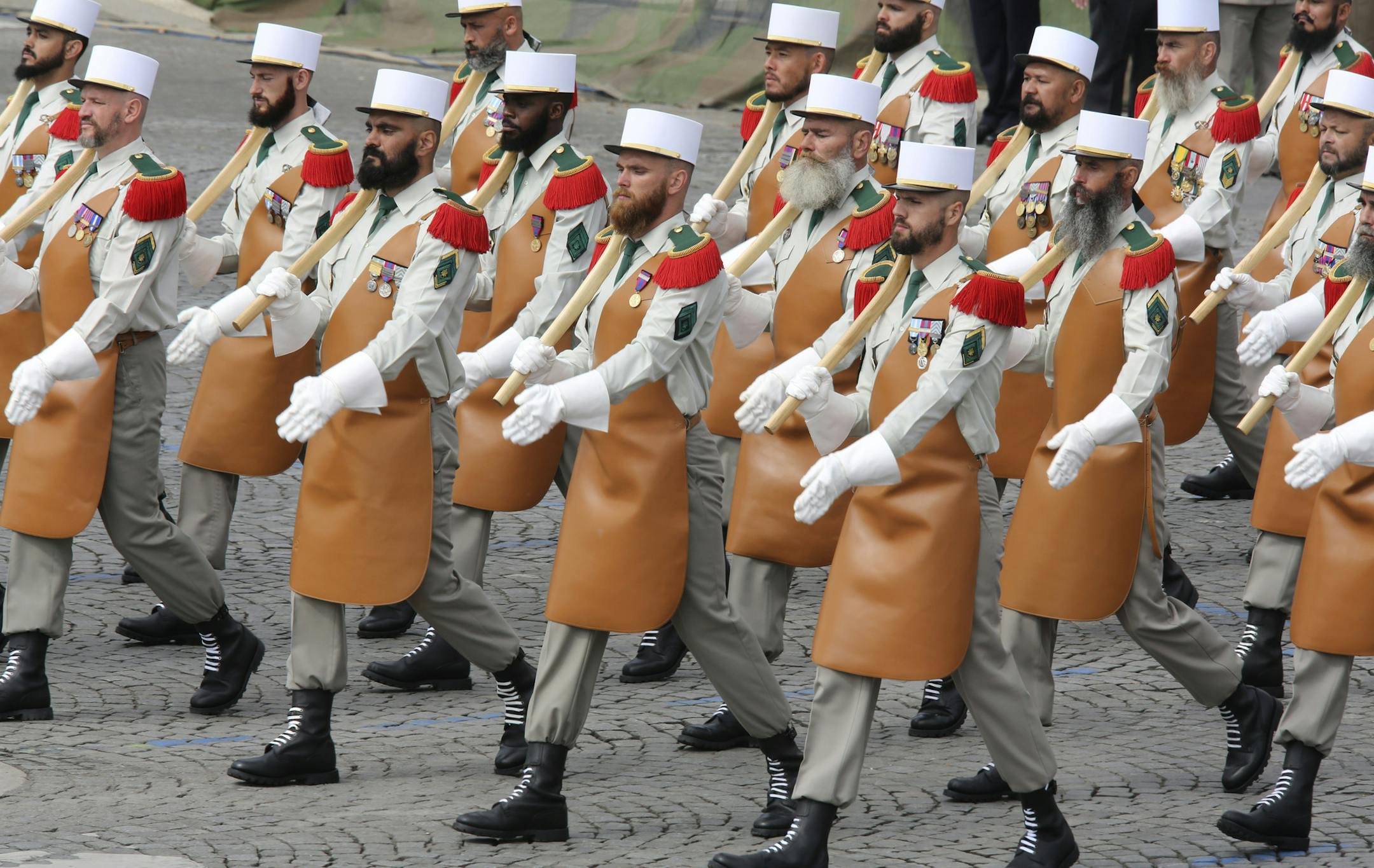 Members of the Foreign Legion parade during the traditional Bastille Day Parade on the Champs Elysees in Paris, Monday, July 14, 2014. (AP Photo/Remy de la Mauviniere)