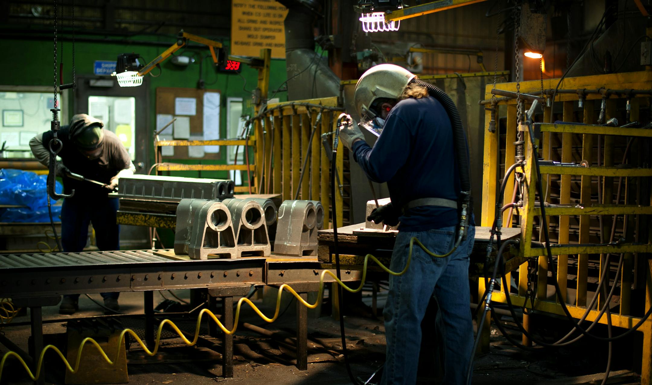 Workers at Badger Foundry in Winona inspected cast oil pans manufactured for Catarpillar, Thursday, February 16, 2012. The company has been on a hiring spree lately due to an increase in orders. ] GLEN STUBBE * gstubbe@startribune.com KEY WORDS IF USED FOR FILE: manufacturing, hire, hiring, jobs, employee, employees, new, industry, minnesota, workers ORG XMIT: MIN2013040517485755
