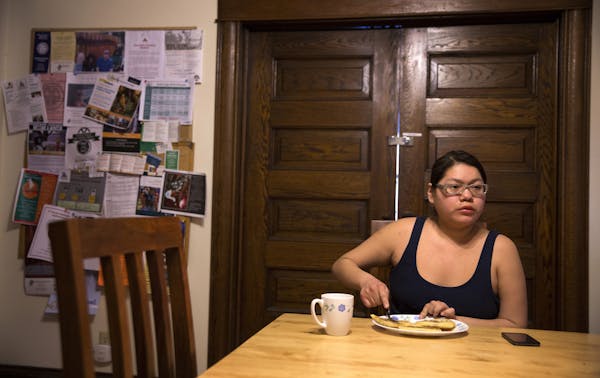 Rosalyn Feather eats breakfast at home in the Beverley A. Benjamin Youth Lodge in St. Paul on Monday, March 16, 2015. ] LEILA NAVIDI leila.navidi@star