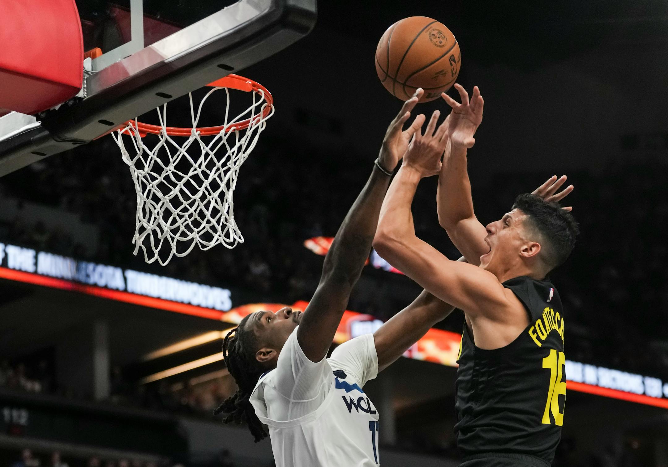 Minnesota Timberwolves center Naz Reid (11) knocks Utah Jazz forward Simone Fontecchio's (16) ball in the first half. The Minnesota Timberwolves hosted the Utah Jazz at Target Center on Thursday, Nov. 30, 2023 in Minneapolis, Minn. ] RENEE JONES SCHNEIDER • renee.jones@startribune.com