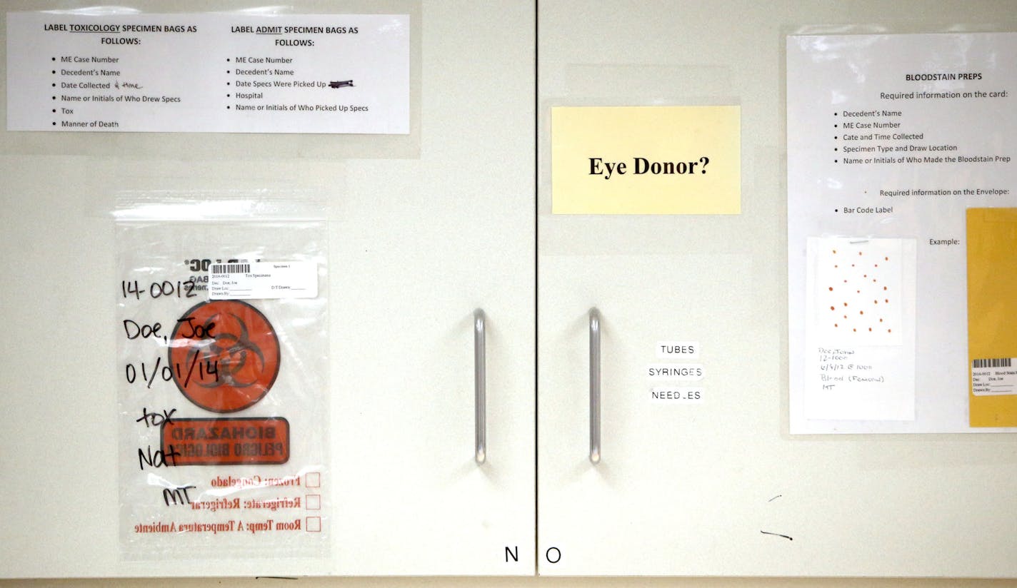 Autopsy reminder sheet on a cabinet at the Hennepin County Medical Examiner's office Thursday, June 28, 2015 in Minneapolis, MN.](DAVID JOLES/STARTRIBUNE)djoles@startribune.com Families visiting the medical examiner's office for the traumatizing experience of identifying a loved one must search for parking in the shadow of the new Vikings stadium. The location of Chief Medical Examiner Dr. Andrew Baker's office is less than ideal and limits plans for expansion. Baker, who already oversees autops