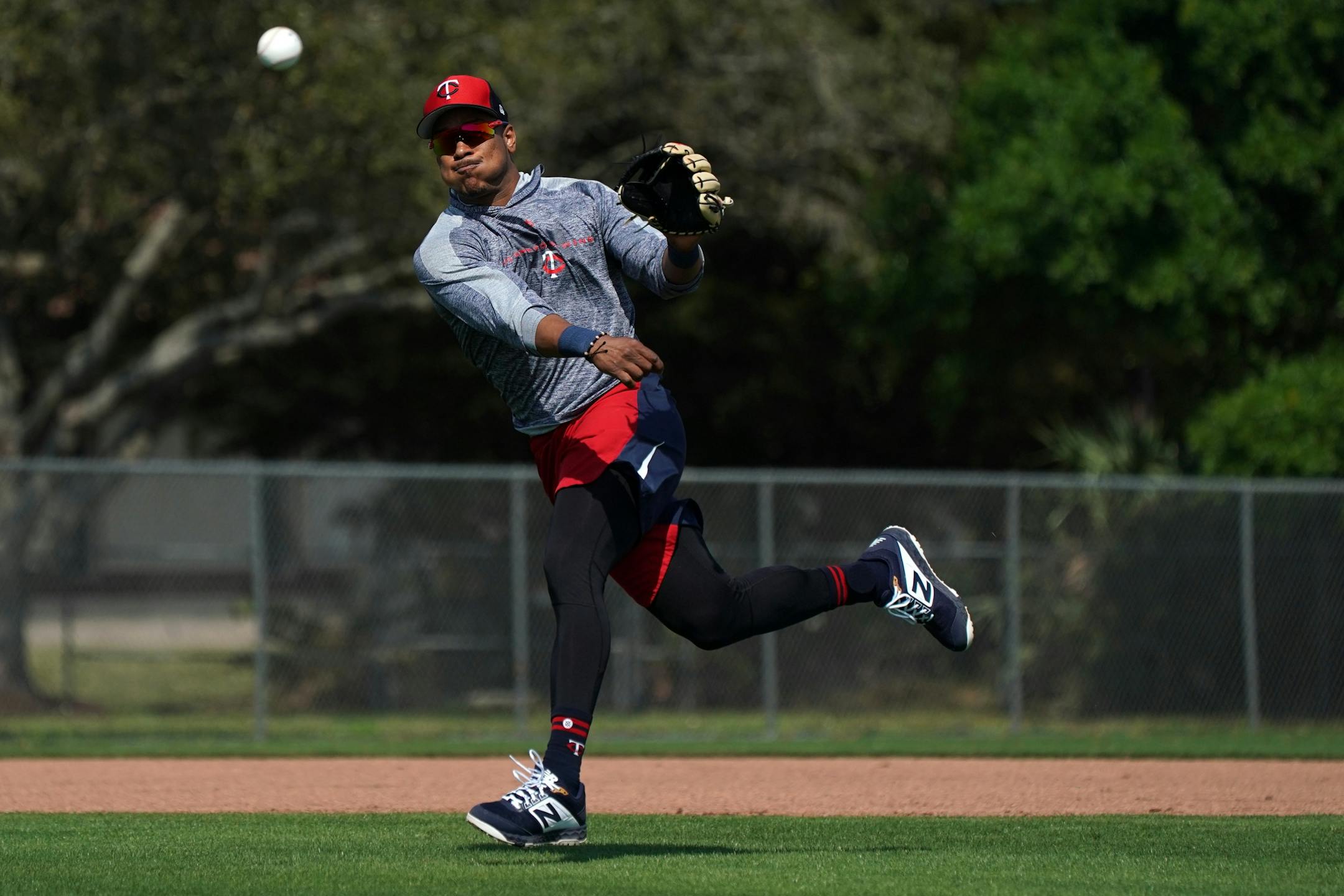 Minnesota Twins shortstop Jorge Polanco (11) threw to first after fielding a ball during informal drills Saturday.
