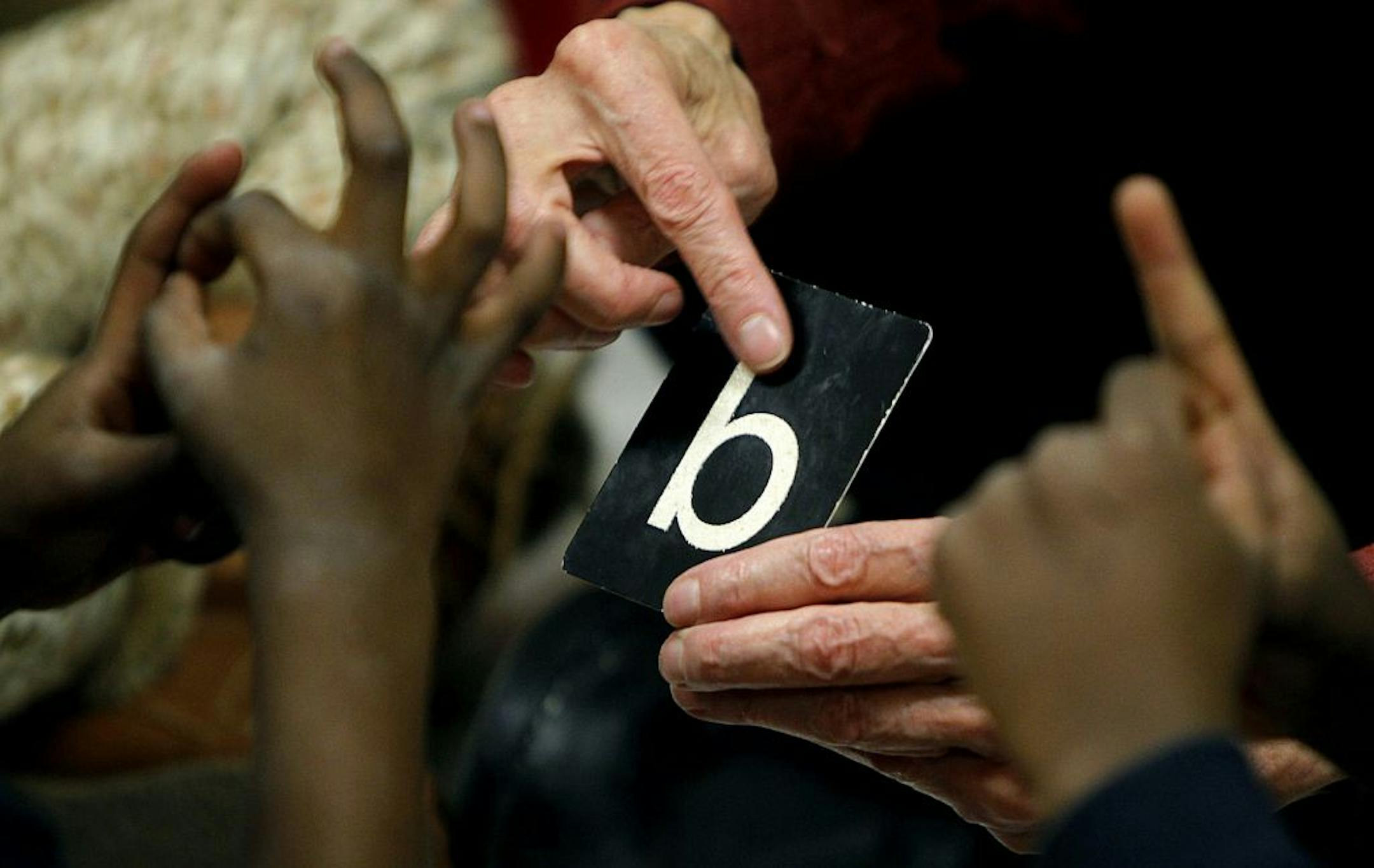 French teacher Theresa Vertuno taught students the alphabet. The school's philosophy lets those closest to the classroom make the decisions.