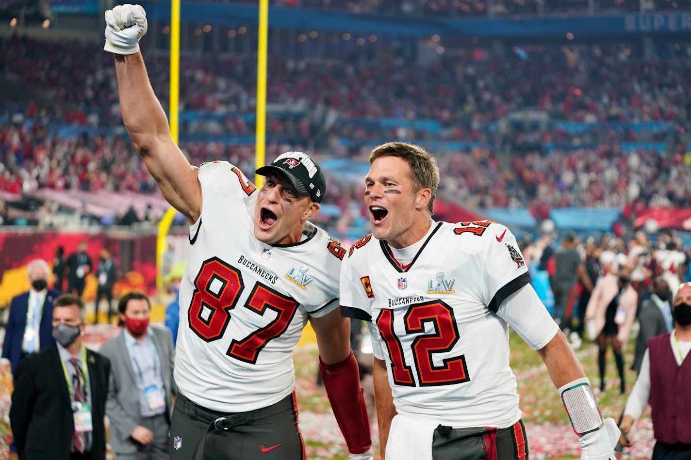 Tampa Bay Buccaneers tight end Rob Gronkowski (87), left, and Tampa Bay Buccaneers quarterback Tom Brady (12) celebrate together after the NFL Super Bowl 55 football game against the Kansas City Chiefs, Sunday, Feb. 7, 2021, in Tampa, Fla. The Tampa Bay Buccaneers defeated the Kansas City Chiefs 31-9. (AP Photo/Steve Luciano)