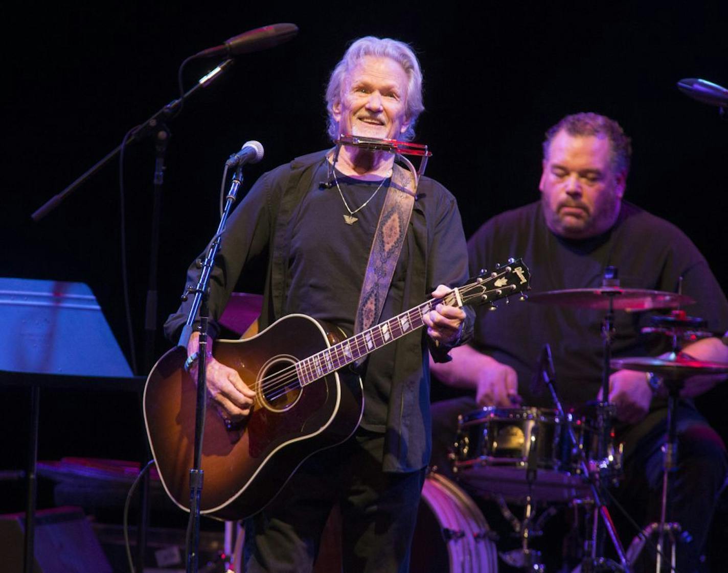 FILE - In this April 12, 2019, file photo, Kris Kristofferson performs in concert at The American Music Theatre in Lancaster, Pa. Kristofferson surprised customers when he performed with an acoustic guitar at a North Dakota bar after a band taped a request to the singer-songwriter's tour bus. Kristofferson stopped at Dempsey's Public House in downtown Fargo on Saturday night, Nov. 9, 2019, and asked to sing with the band 32 Below.