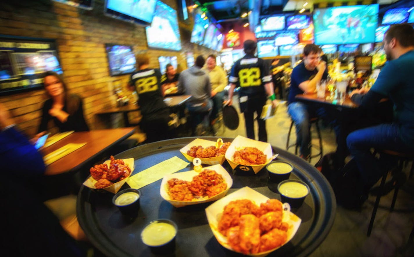 Wings headed for customers at Buffalo Wild Wings at the University of Minnesota ] GLEN STUBBE * gstubbe@startribune.com Thursday, March 20, 2014.