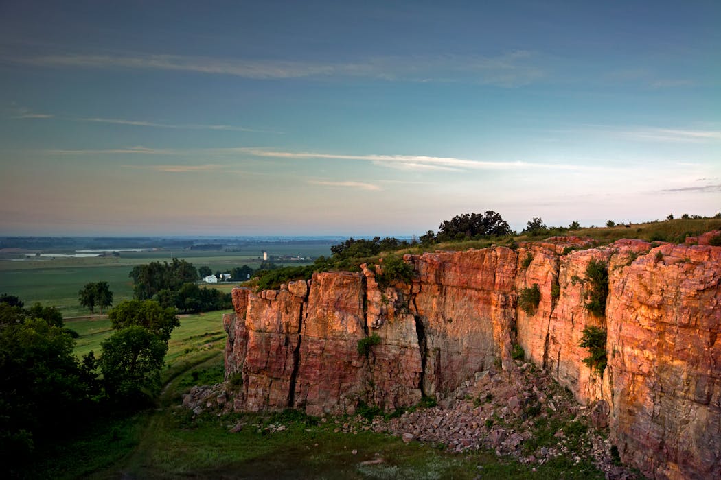The quartzite cliff at Blue Mounds State Park rises 100 feet above the prairie.