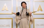 Chloe Zhao, winner of the awards for best picture and director for "Nomadland," poses in the press room at the Oscars on Sunday, April 25, 2021, at Un