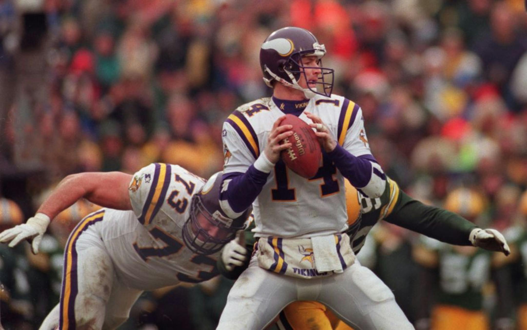 -- Vikings quarterback Brad Johnson avoids the pressure from the Packer defense at Green Bay.